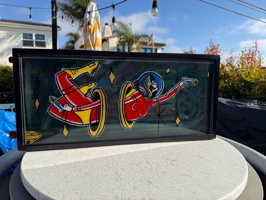 Astronaut pinstripe painting on vintage pinball machine 